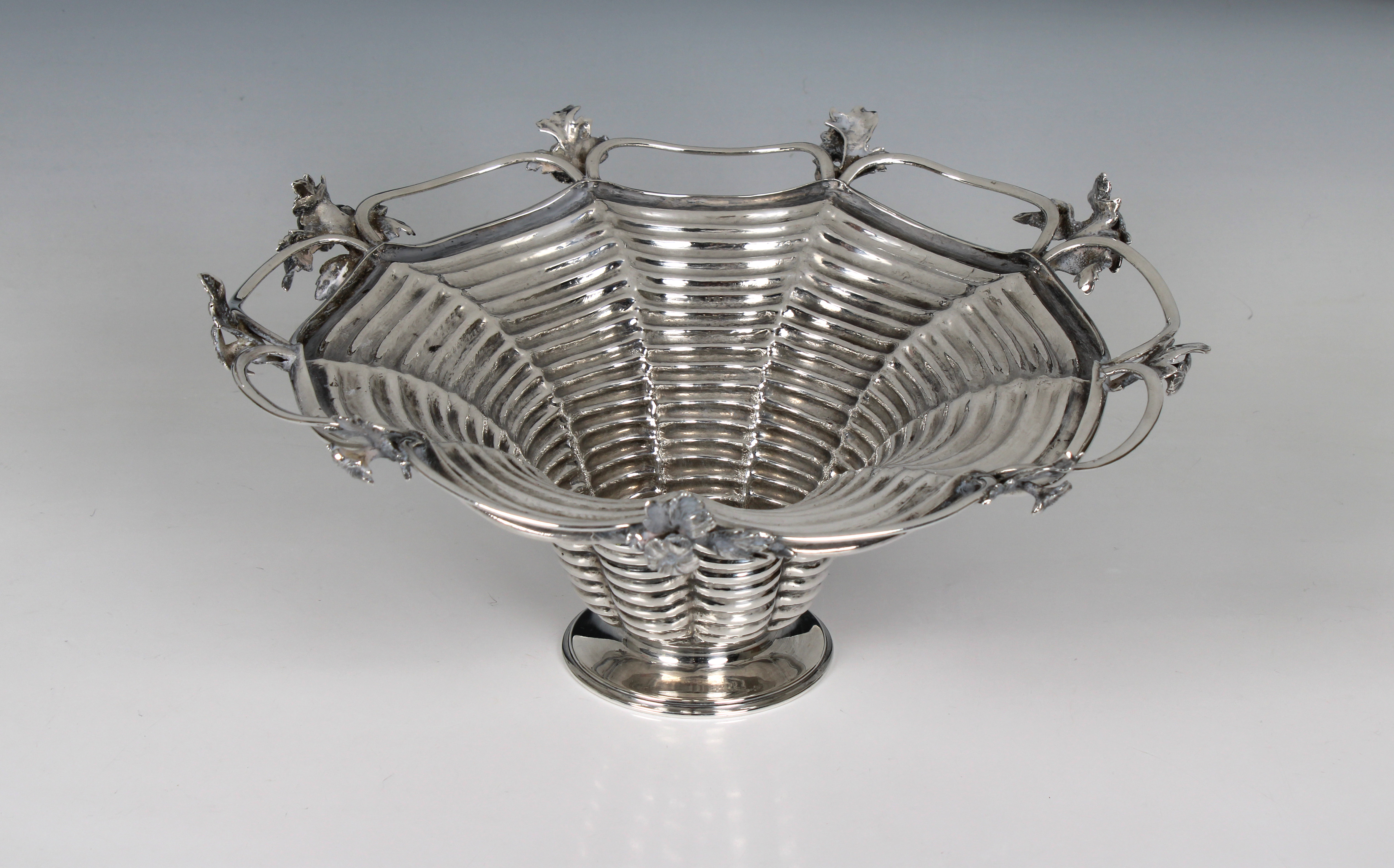 An unusual Victorian nonagonal silver fruit basket or table centrepiece