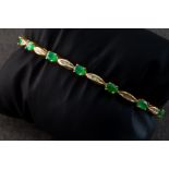 An emerald and diamond bracelet