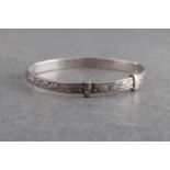 A silver christening bangle