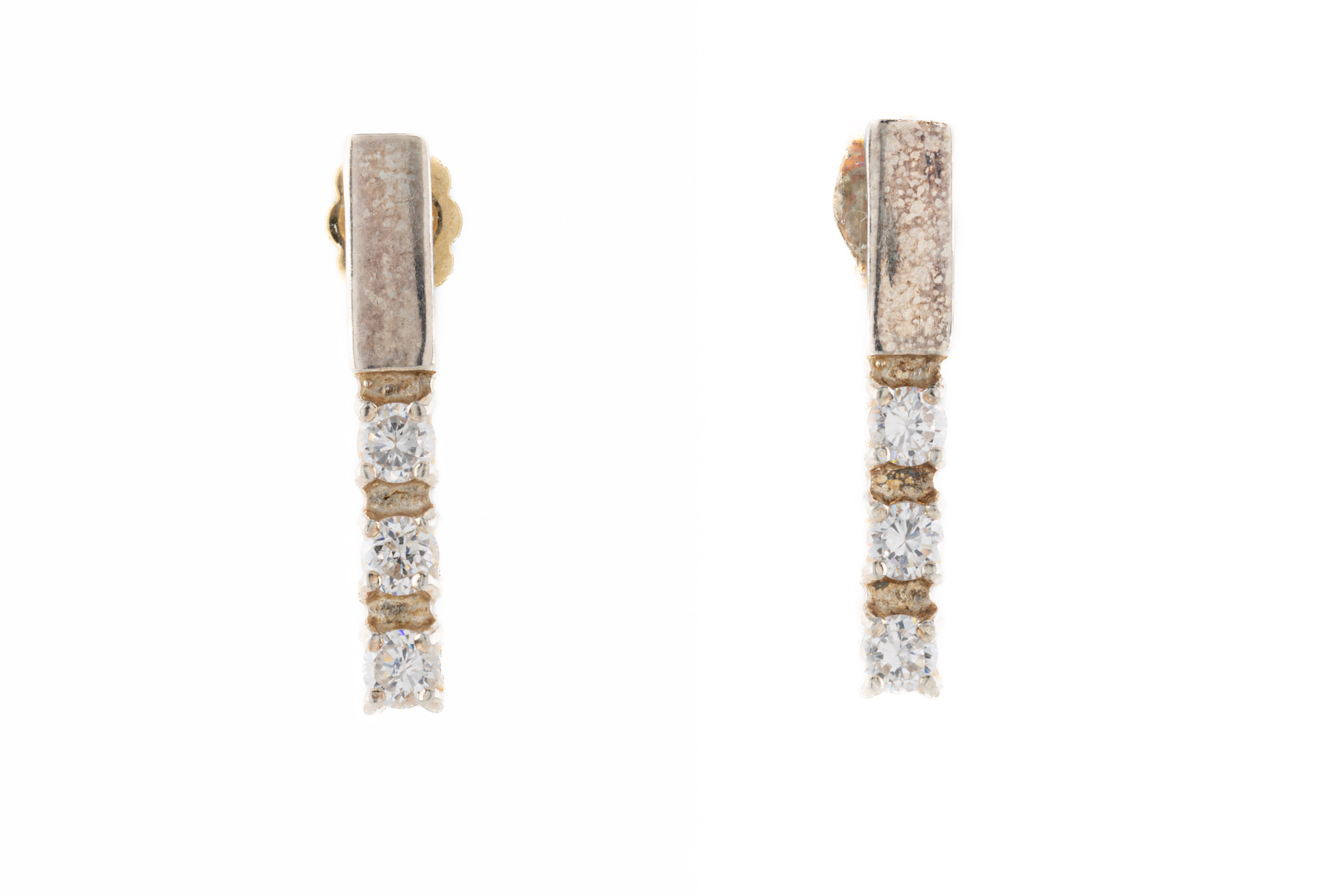 A pair of silver and diamond earrings