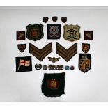 A collection of Military and Guernsey patches / badges