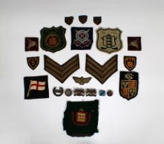 A collection of Military and Guernsey patches / badges