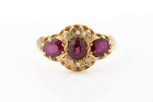 An 18ct gold, diamond and ruby cluster ring