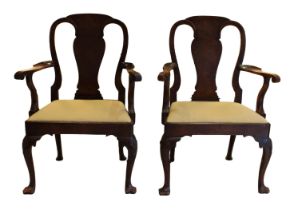 A pair of 19th Century George I style walnut elbow chairs