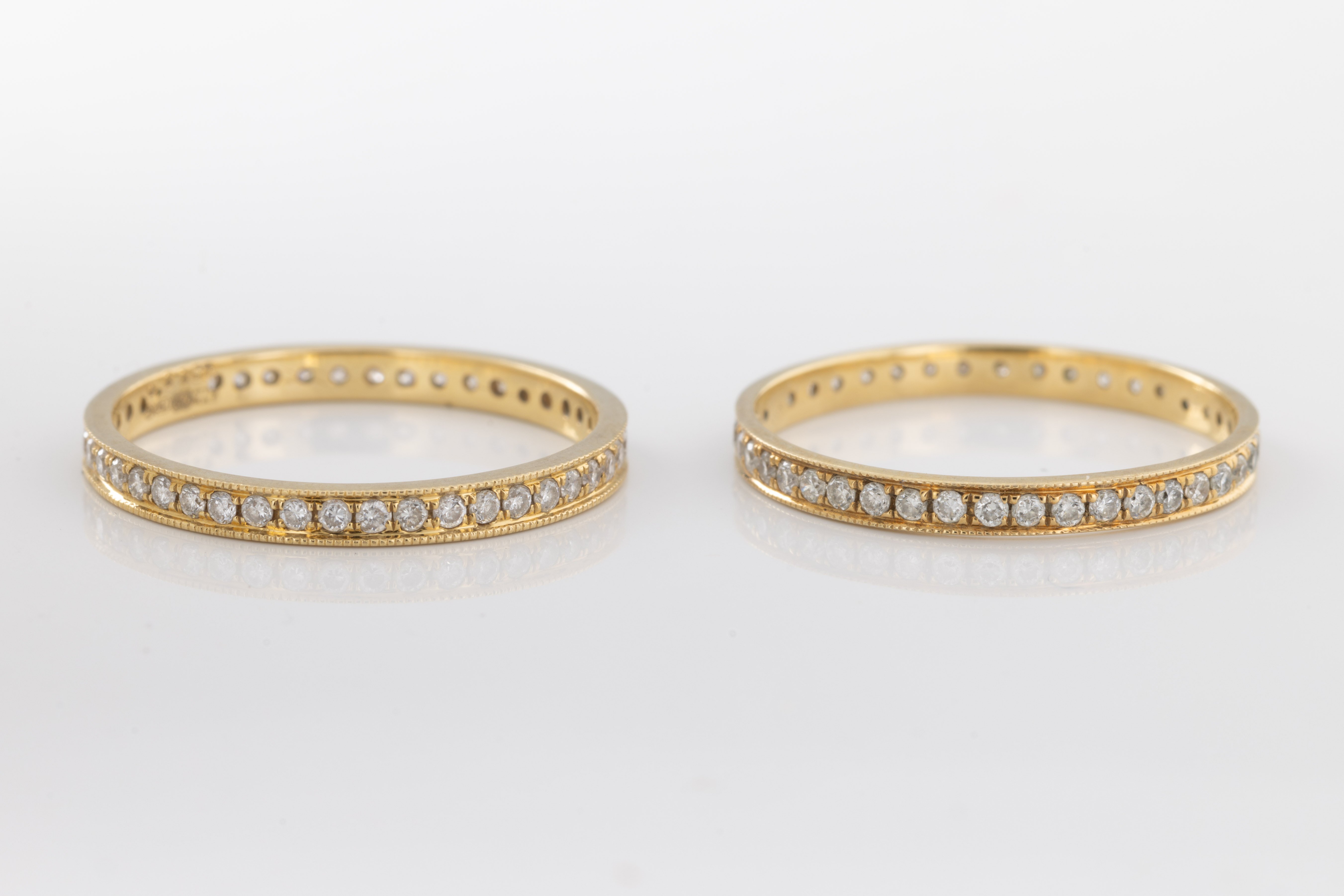 Two 18ct yellow gold and diamond eternity rings