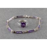 A sterling silver and amethyst solitaire ring and amethyst and zirconia bracelet