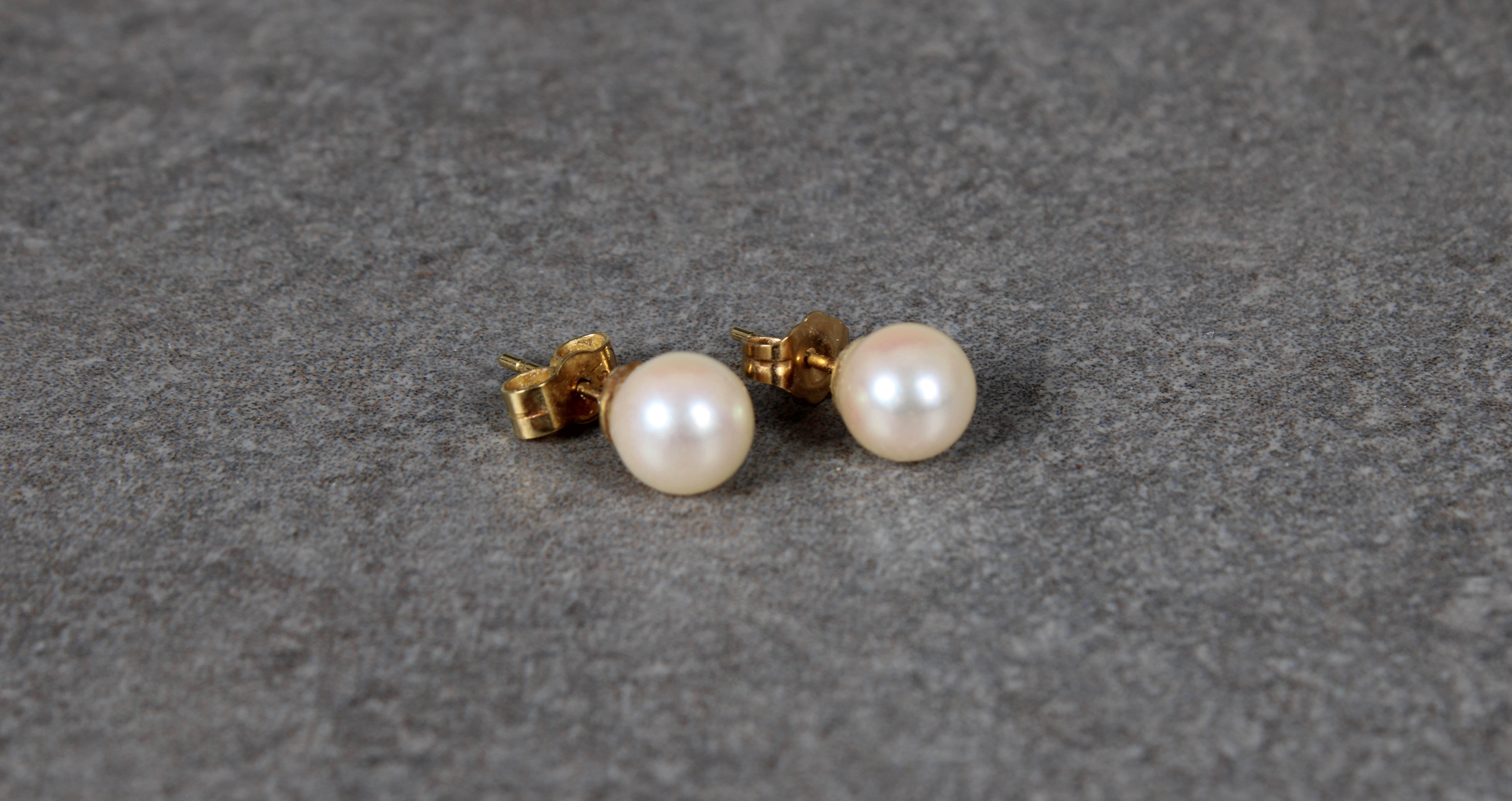 A pair of 18ct yellow gold pearl studs