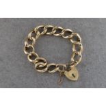 A 9ct yellow gold padlock and chain bracelet