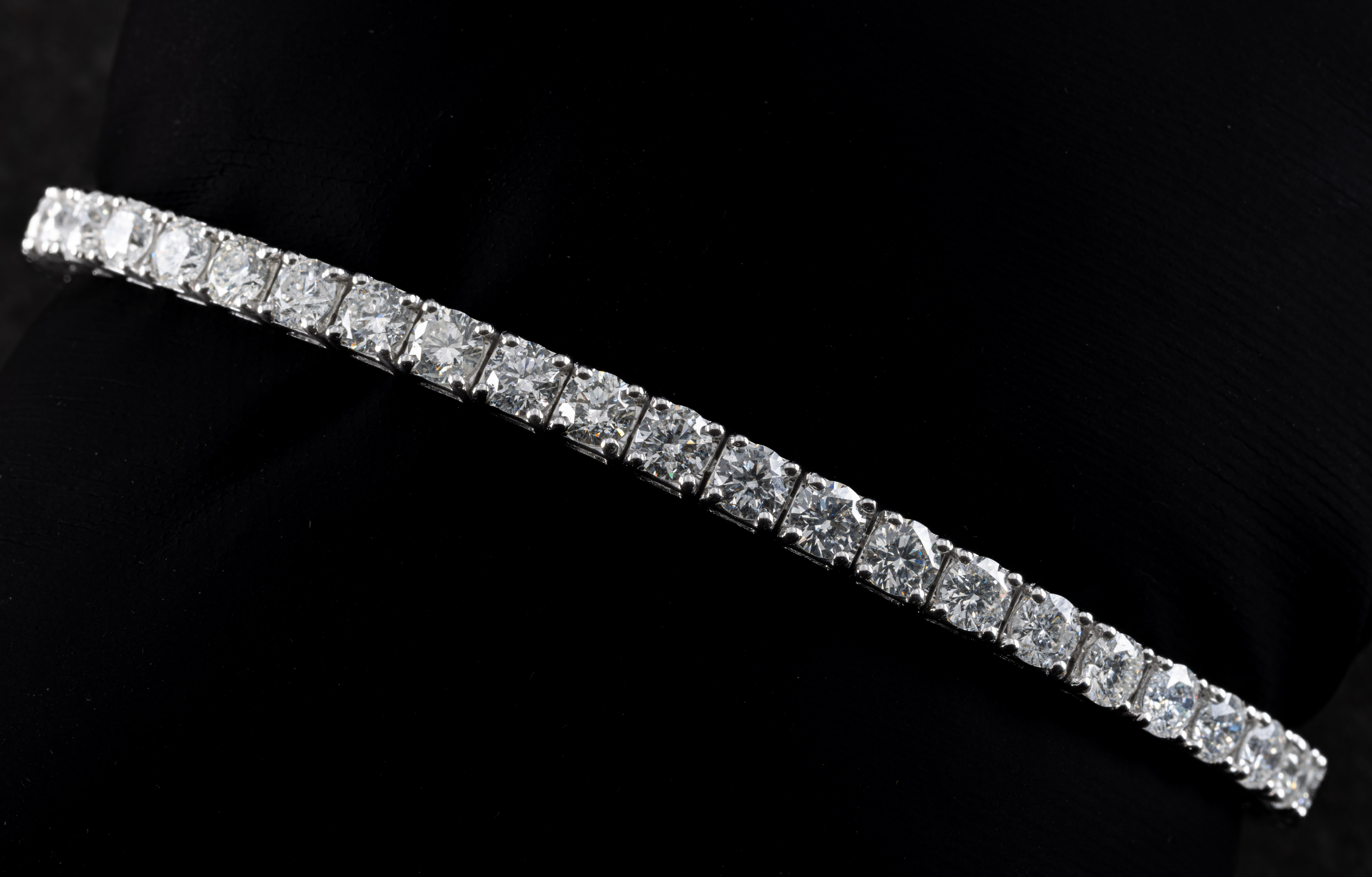 An 18ct white gold and diamond line bracelet
