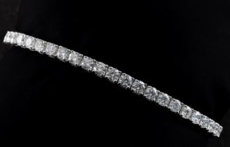 An 18ct white gold and diamond line bracelet