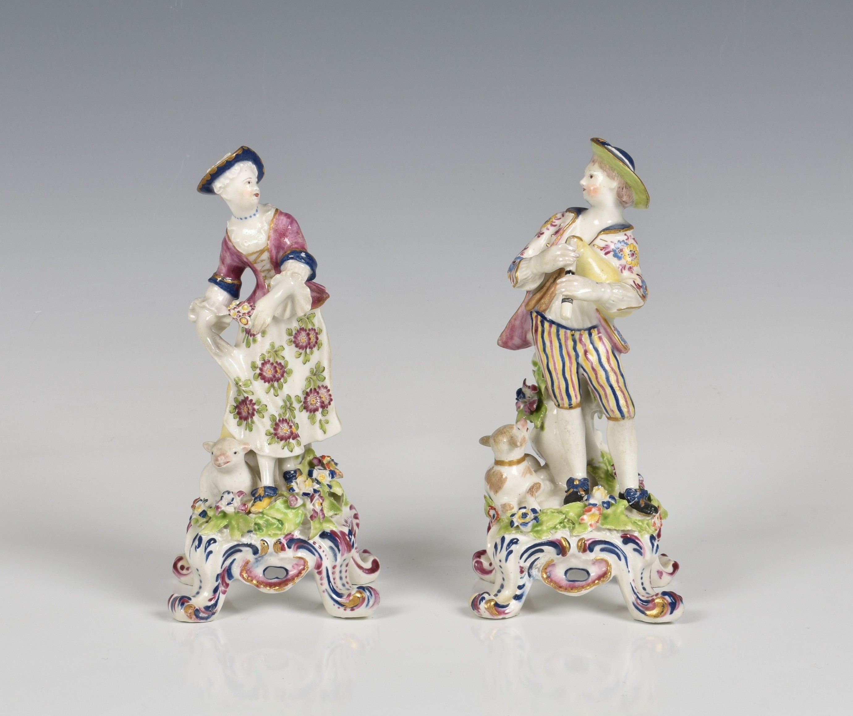 A pair of Bow porcelain figures of a shepherd and shepherdess
