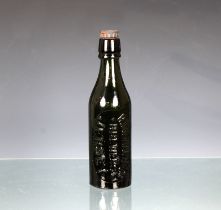 A green 'RANDALL BROs BREWERS JERSEY' beer bottle