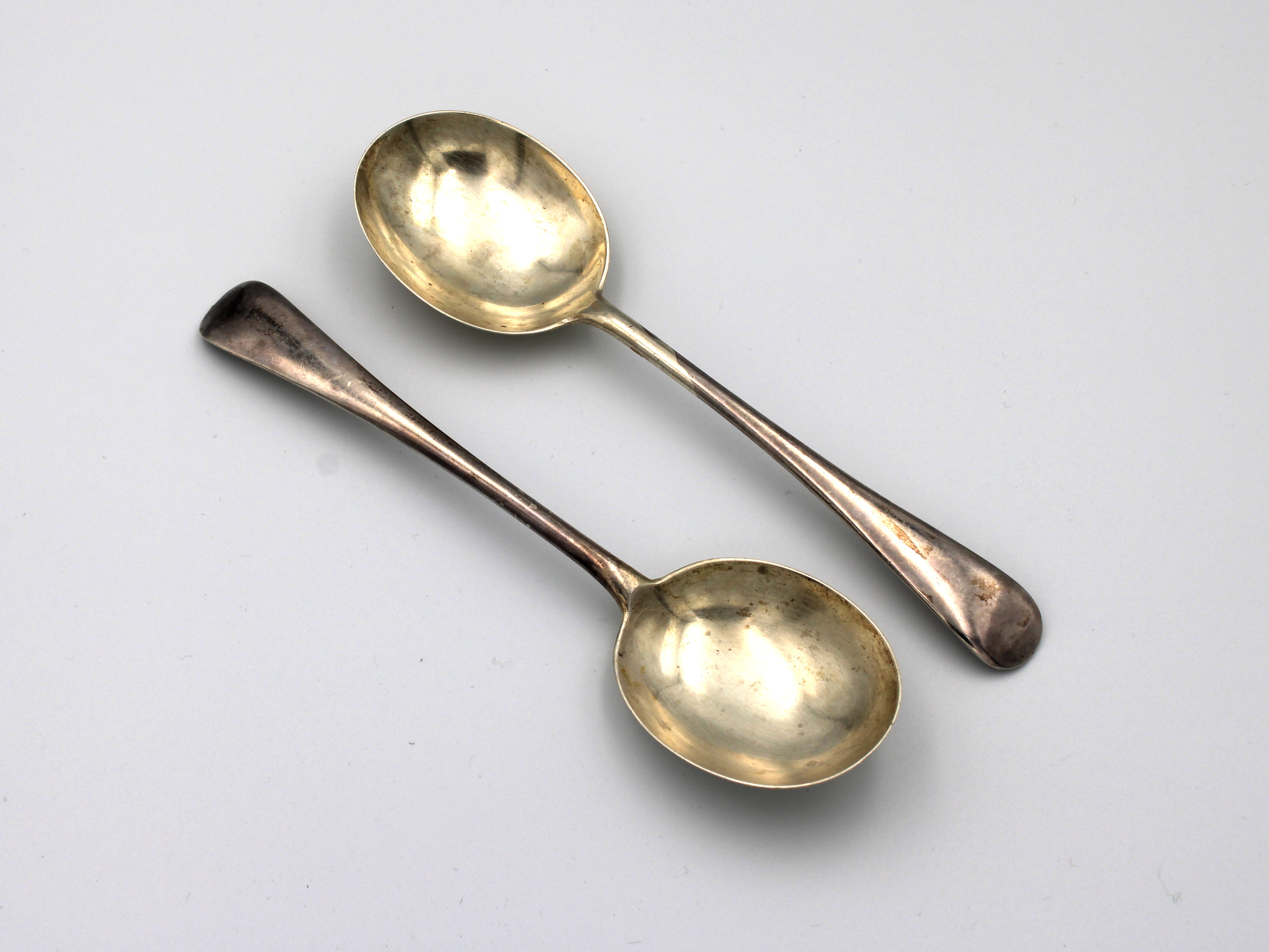 A pair of silver Old English pattern soup spoons