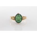 A green stone doublet ring