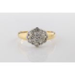 A yellow gold and diamond cluster ring