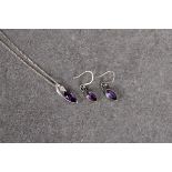 A sterling silver amethyst and CZ pendant necklace and matching earrings