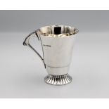 A silver cup with flared rim and spreading foot