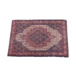 An antique Senneh rug