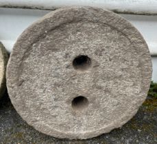 A granite plinth or mill stone