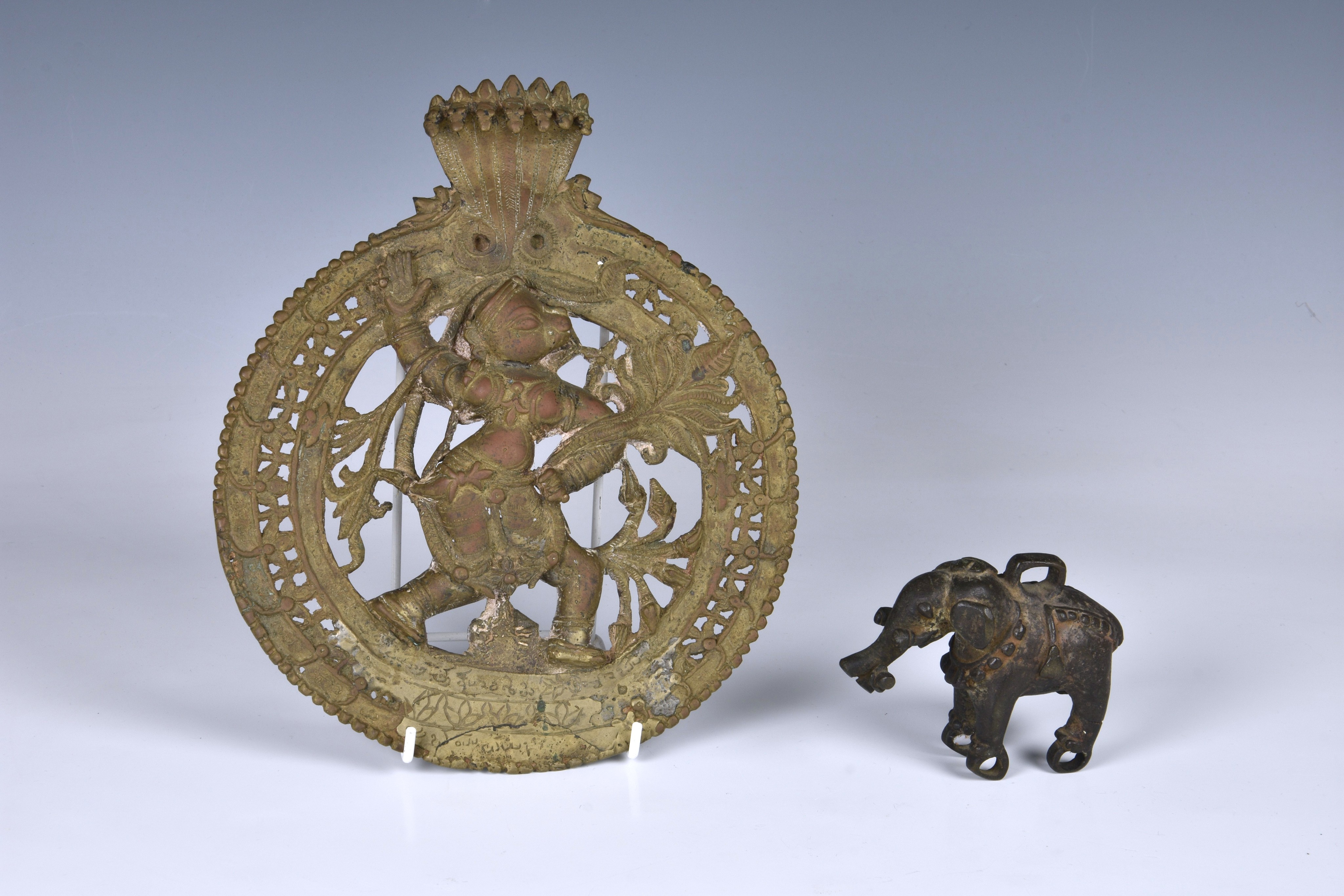 An Indian bronze circular wall plaque of the Hindu monkey headed deity Hanuman