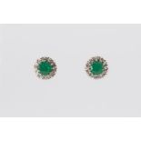 A pair of emerald and diamond cluster earrings