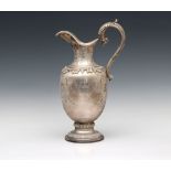 A Garrard silver limited edition wine jug / ewer commemorating the silver wedding of HM Queen Elizab