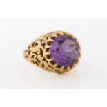 A gold and purple stone ring