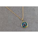 An 18ct yellow gold pendant necklace, the circular coloured glass pendant