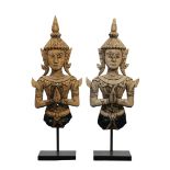 A pair of Indonesian carved wood and mosaic half figures