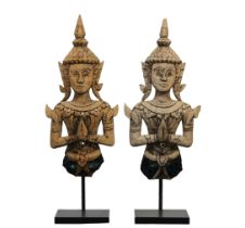 A pair of Indonesian carved wood and mosaic half figures