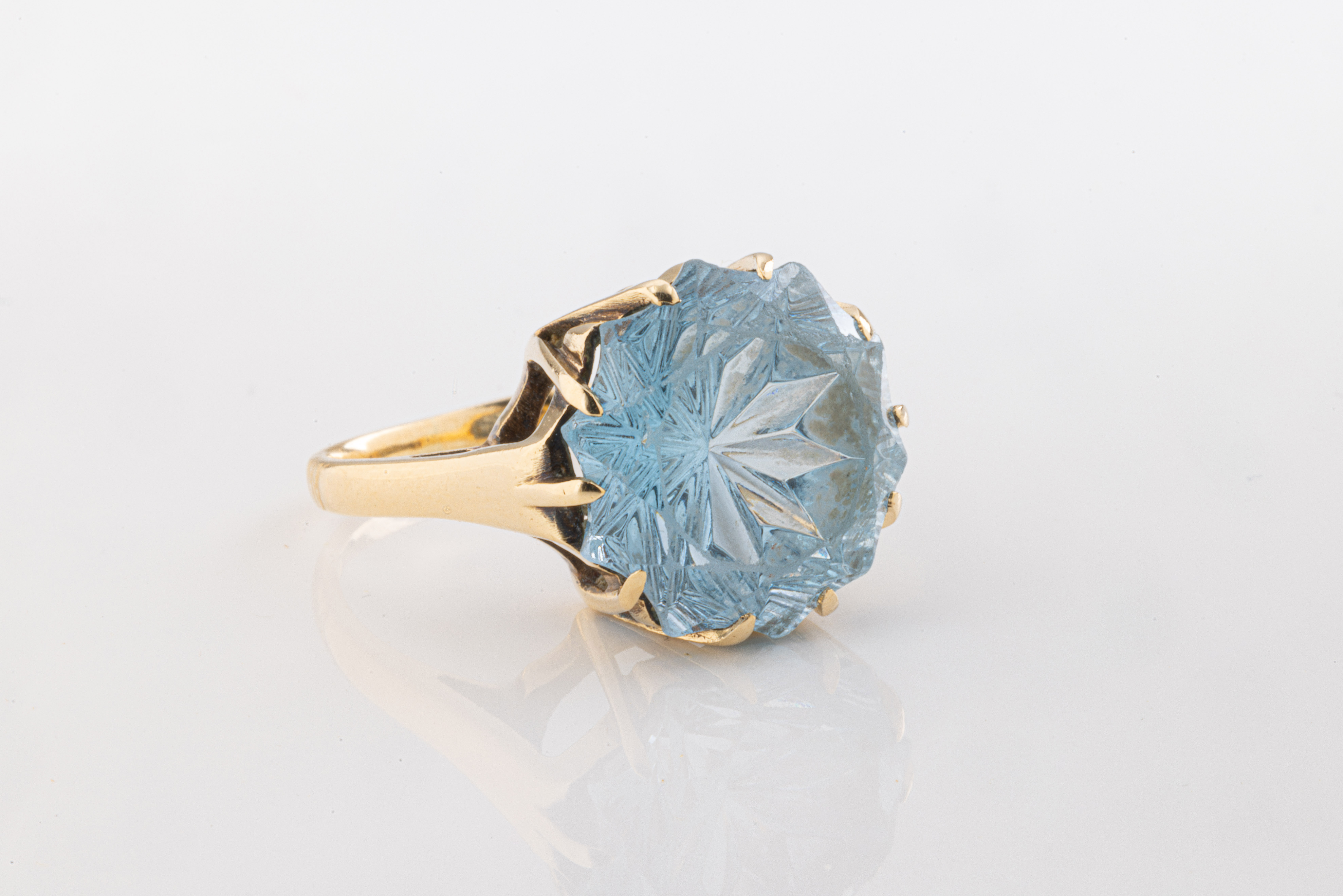 A 9ct yellow gold and fancy cut blue stone ring