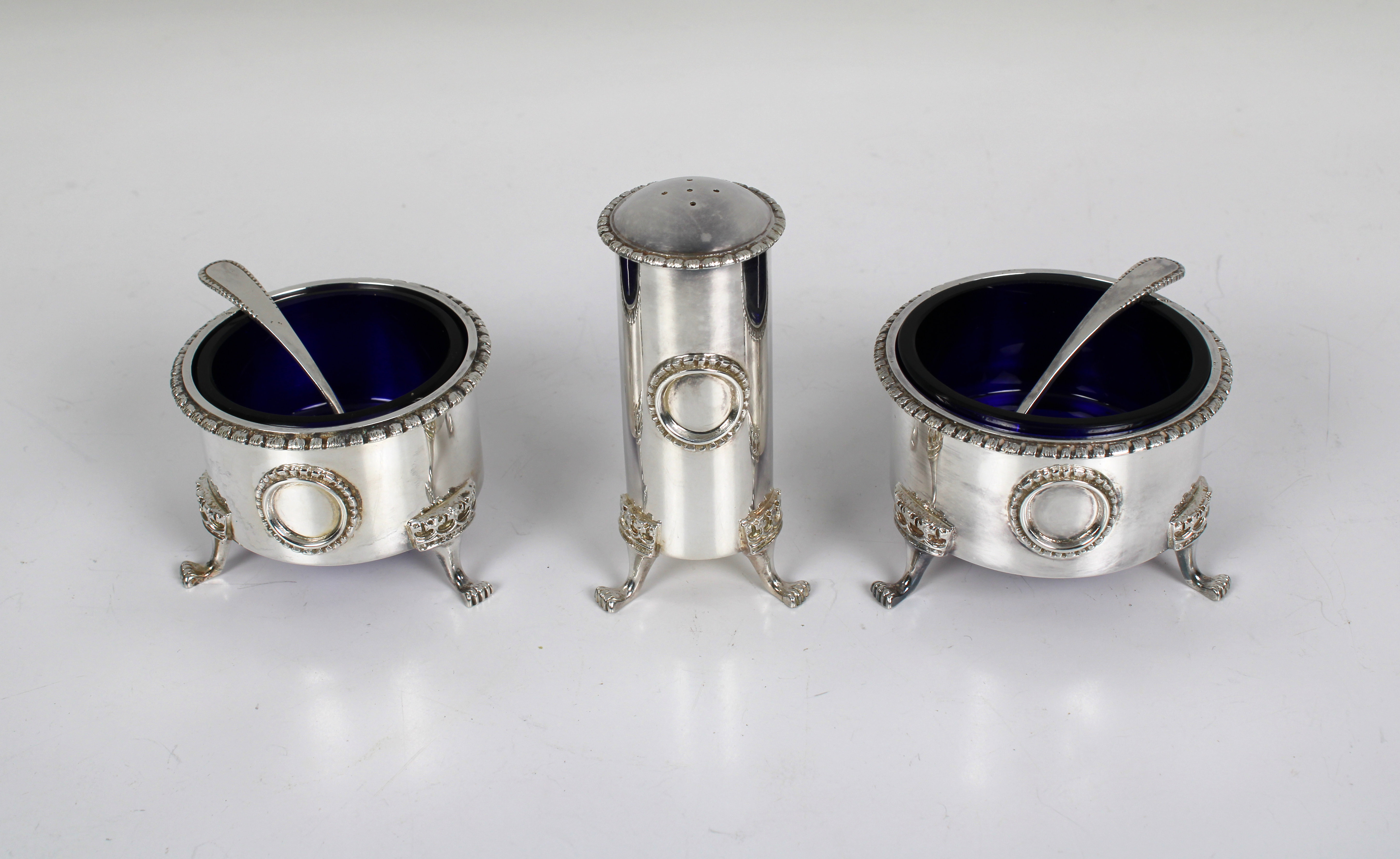 An Elizabeth II three piece silver condiment set