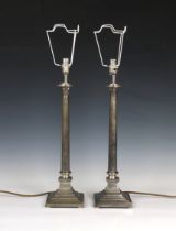A pair of stepped column form metal table lamps