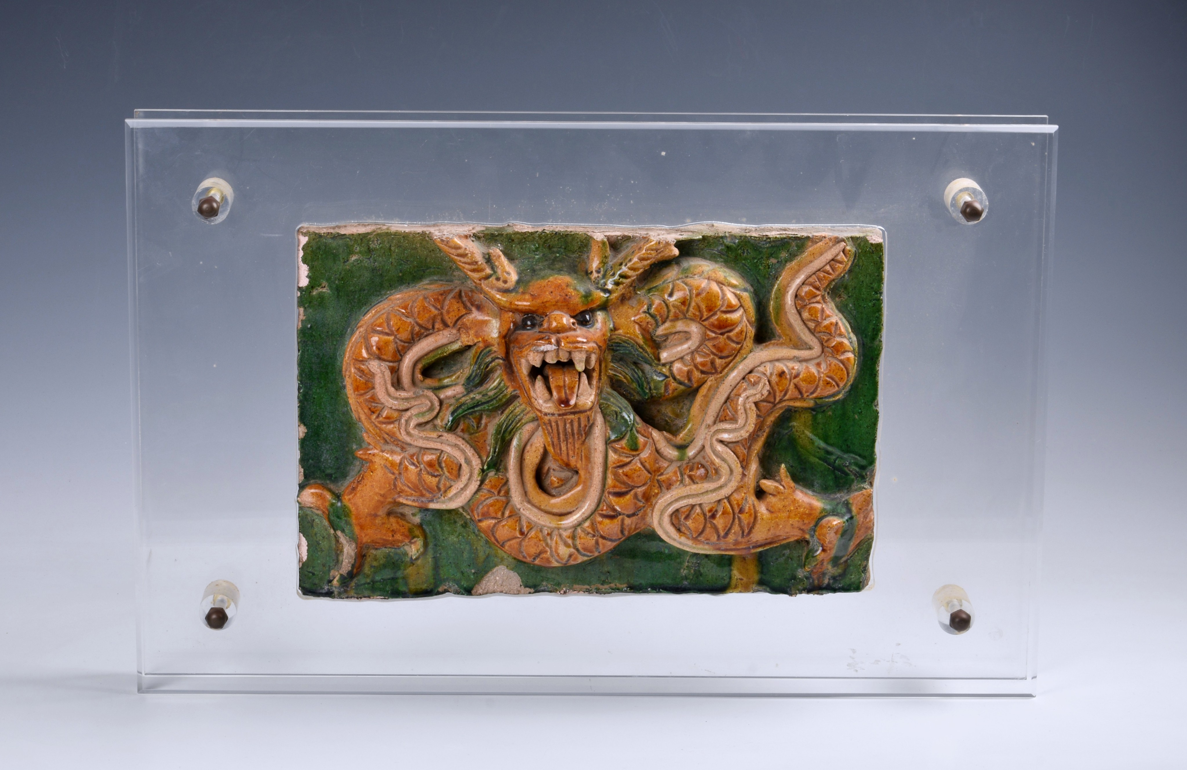 A Chinese sancai glazed pottery dragon temple tile