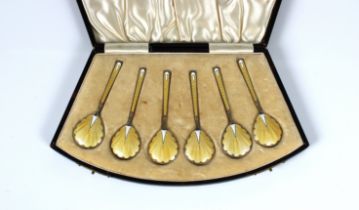 A cased set of six Art Deco silver gilt yellow & white guilloche enamel caviar / demitasse spoons