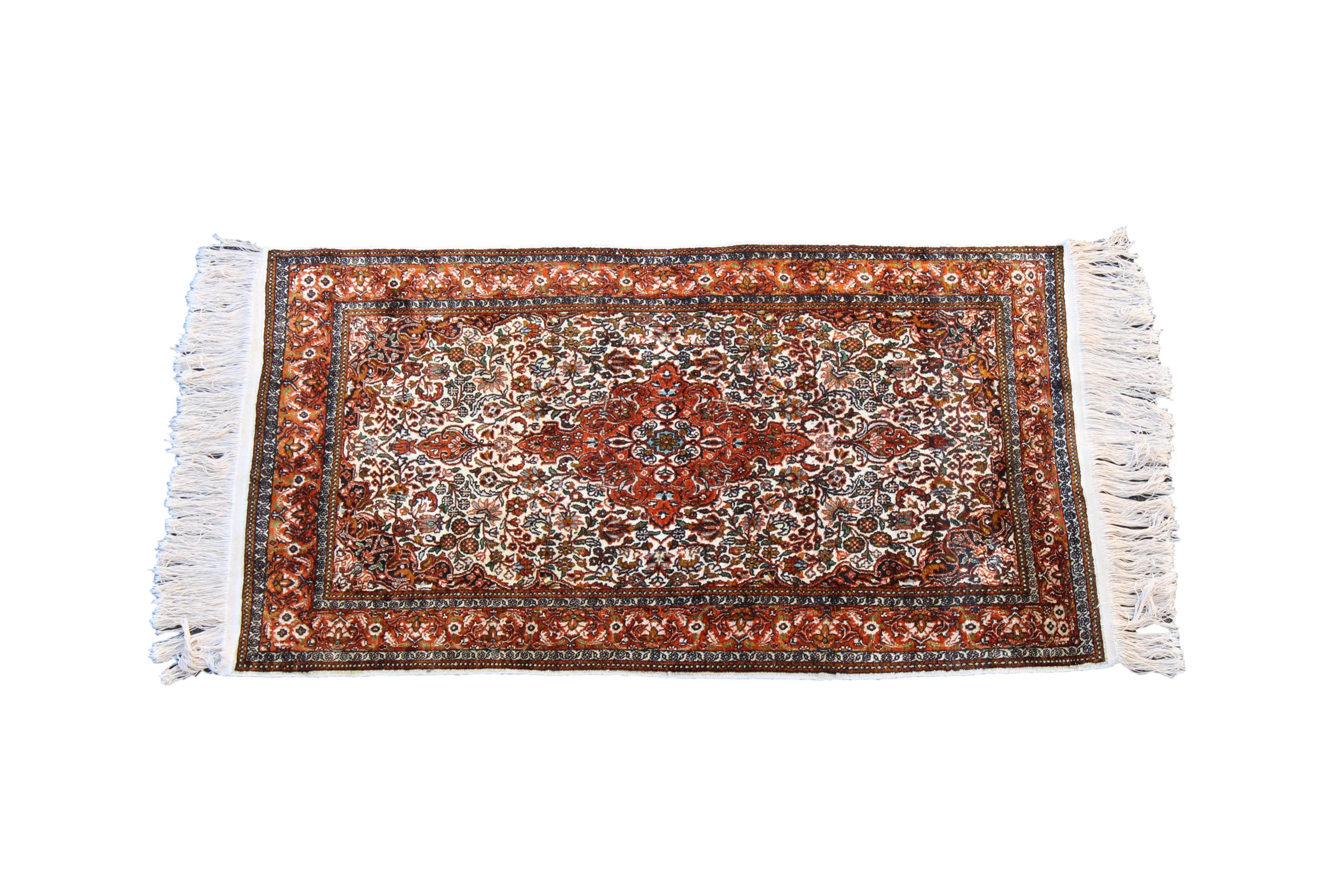 A small Kashan style silk rug