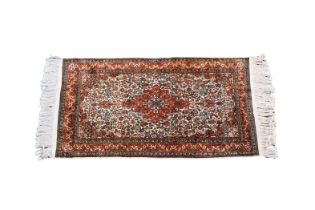 A small Kashan style silk rug