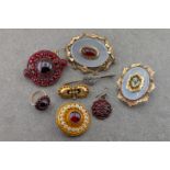 A collection of garnet brooches