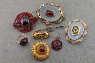 A collection of garnet brooches