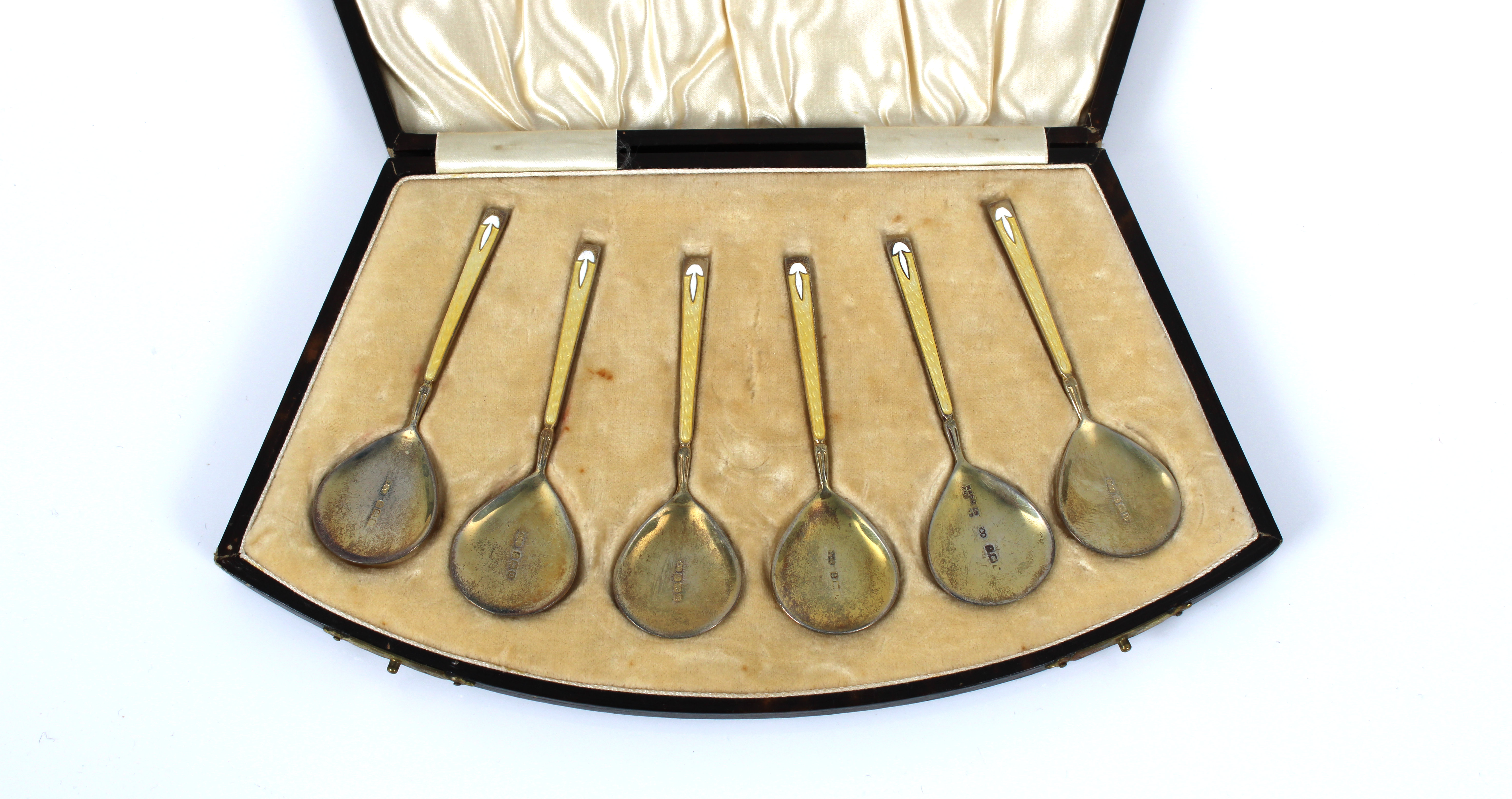 A cased set of six Art Deco silver gilt yellow & white guilloche enamel caviar / demitasse spoons - Image 2 of 2