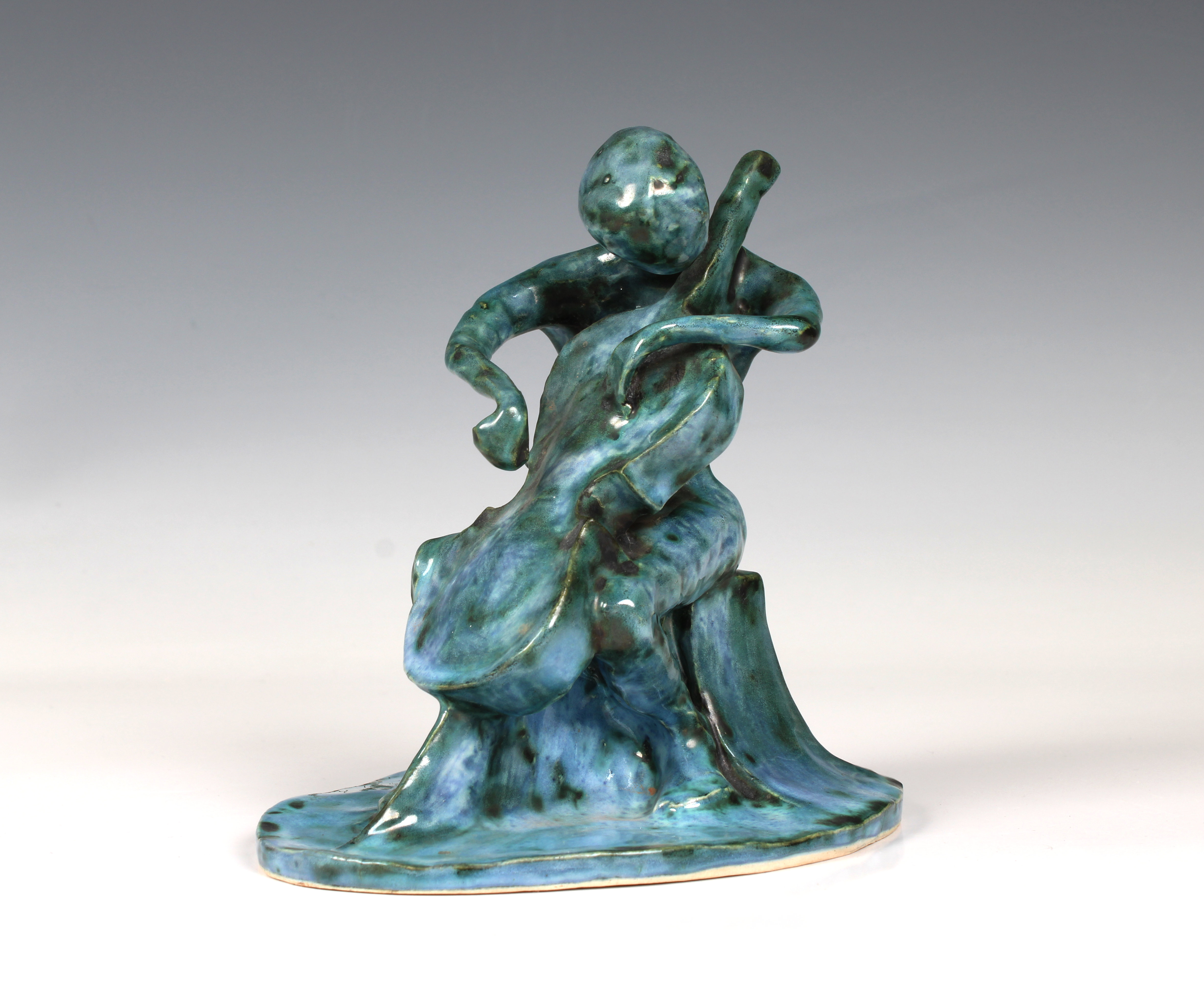 Elizabeth Ann Macphail (1939-89) A turquoise glazed stylised cellist or double bass player sculpture