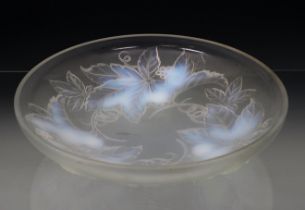 An Art Deco Julien pressed opalescent glass bowl decorated with raised grape and leaf design