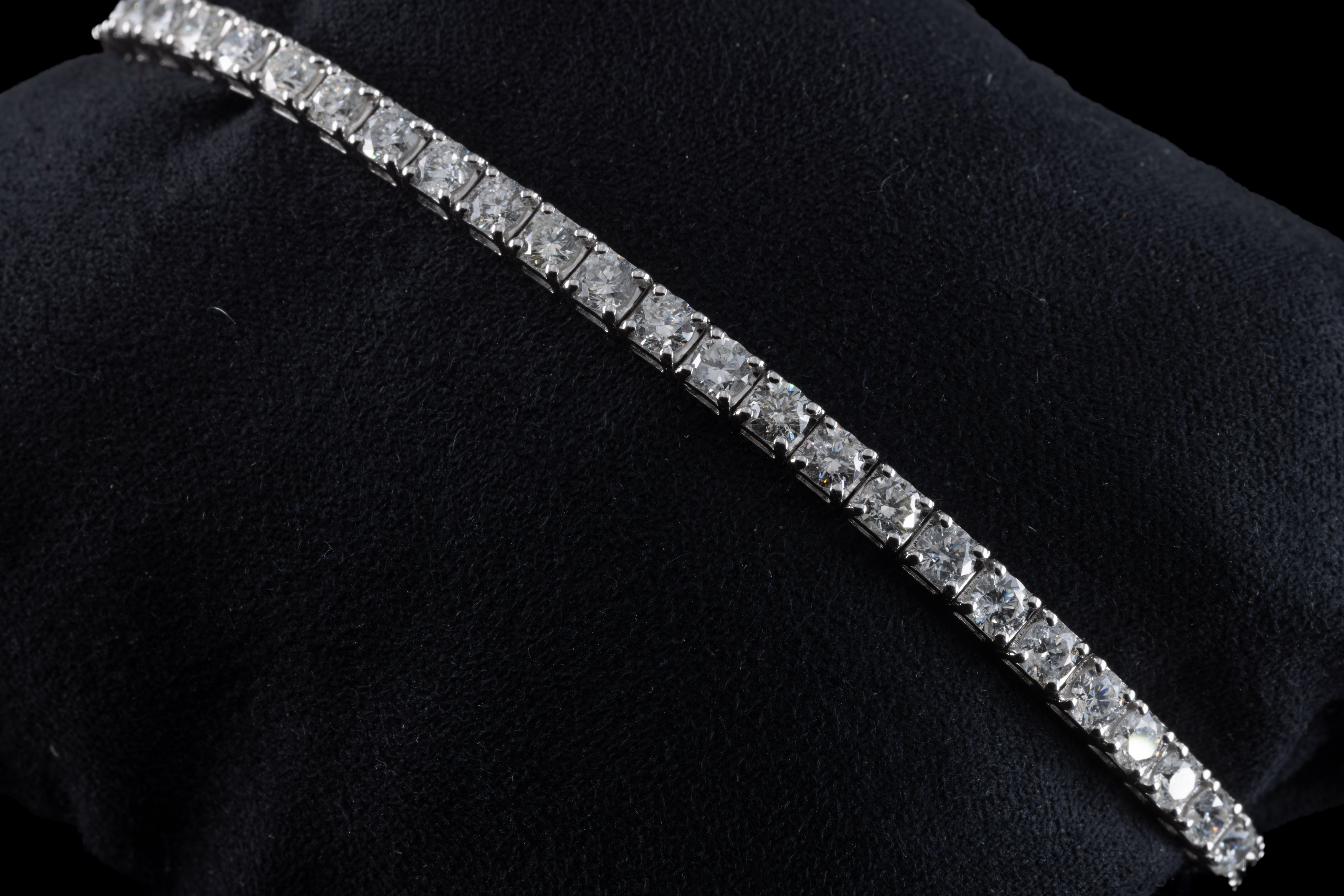 An 18ct white gold and diamond line bracelet