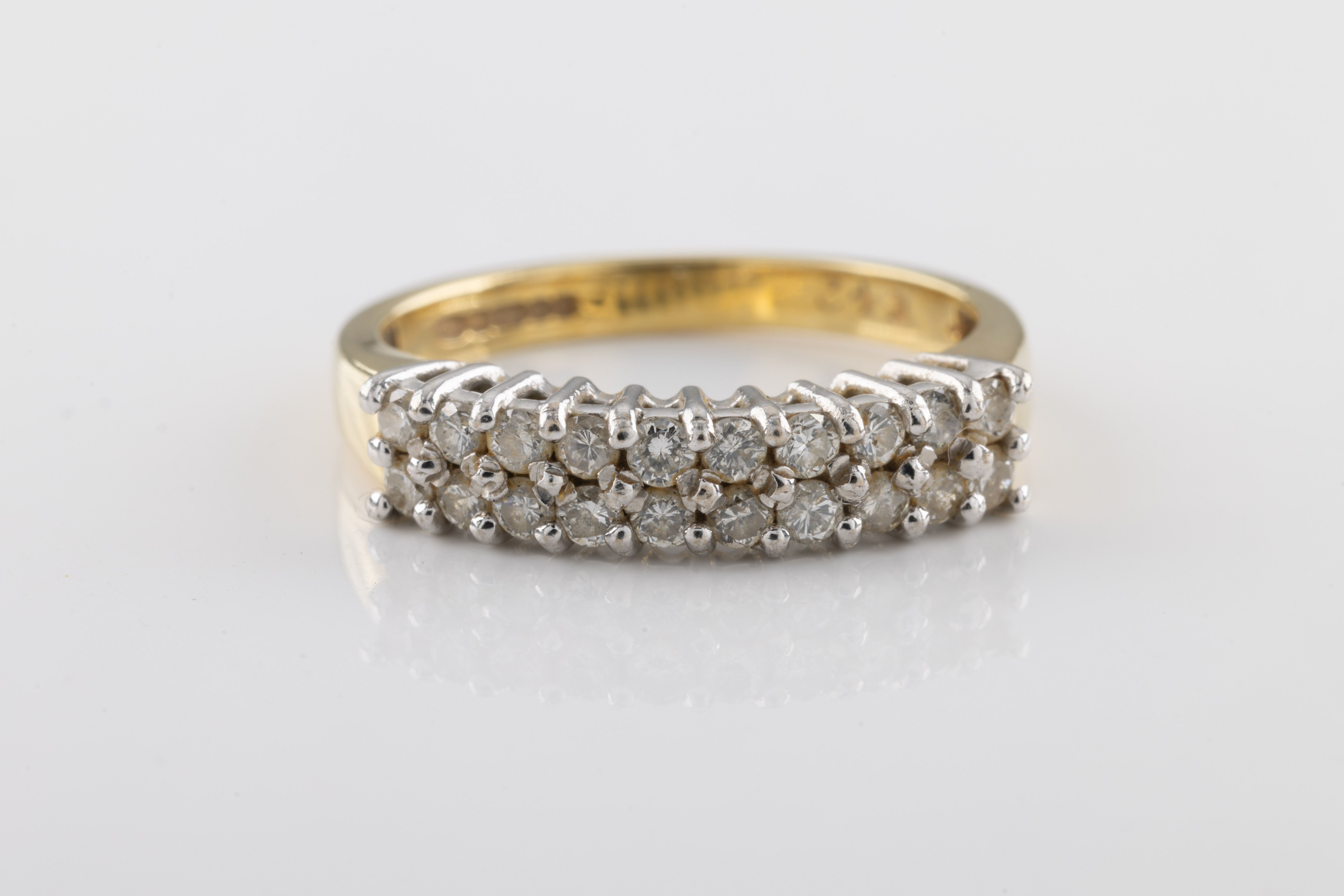 An 18ct yellow gold half eternity diamond ring