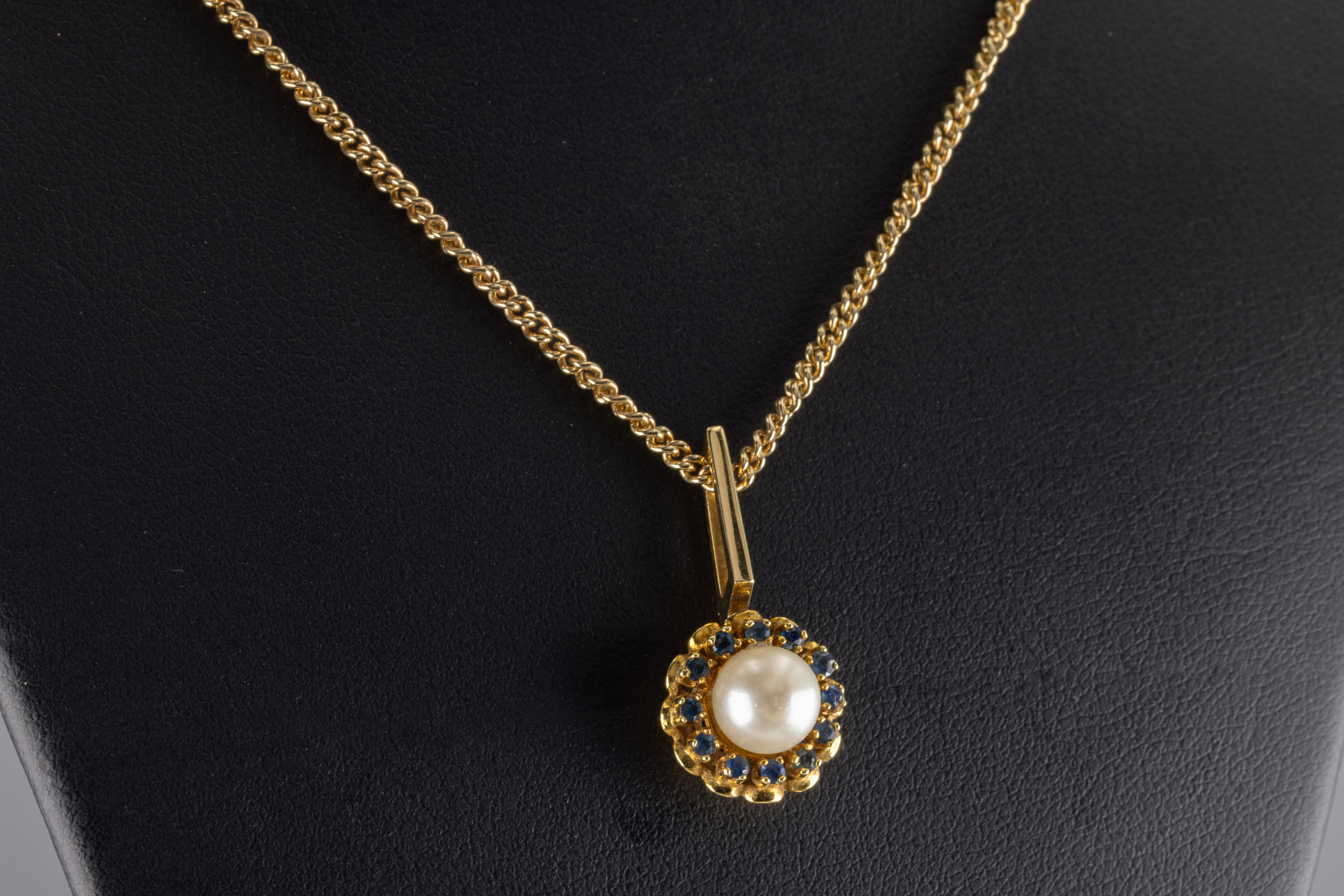 A pearl and sapphire pendant