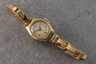 A Shield 9ct yellow gold ladies bracelet watch