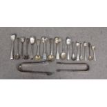 A collection of silver salt / mustard spoons and sugar tongs etc