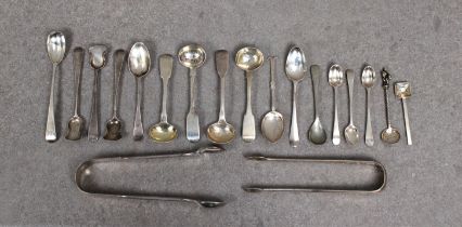 A collection of silver salt / mustard spoons and sugar tongs etc