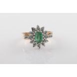 A 9ct yellow gold, emerald and diamond cluster ring