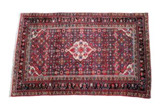 A hand knotted Hamadan wool rug